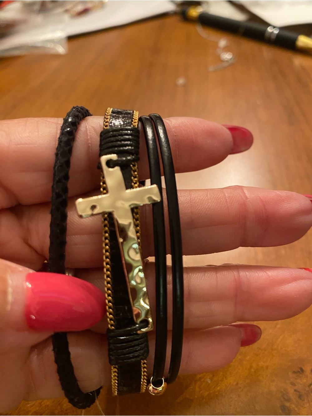 Multi-Strand Black Leather Bracelet with Gold Cross Accent